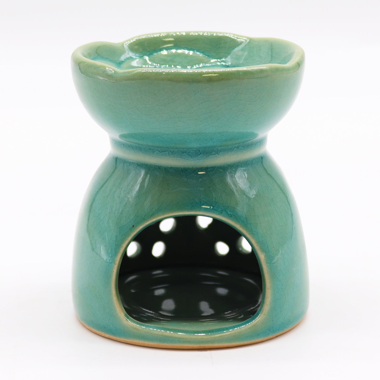 Carefully sourced by The Original Candle Company and featuring a classic tree of life design with a highly decorative glaze in blue, this oil burner and wax warmer will make an attractive decoration in any room. Image shows the tealight cut-out at the rear of the burner.