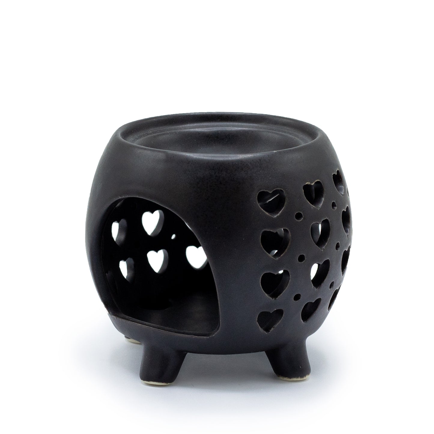 Carefullly sourced by The Original Candle Company and featuring a squat pot style with multi heart cut-out pattern in matt black, this oil burner and wax warmer will make an attractive decoration in any room. This image shows the rear of the oil burner & wax warmer where the tealight goes.