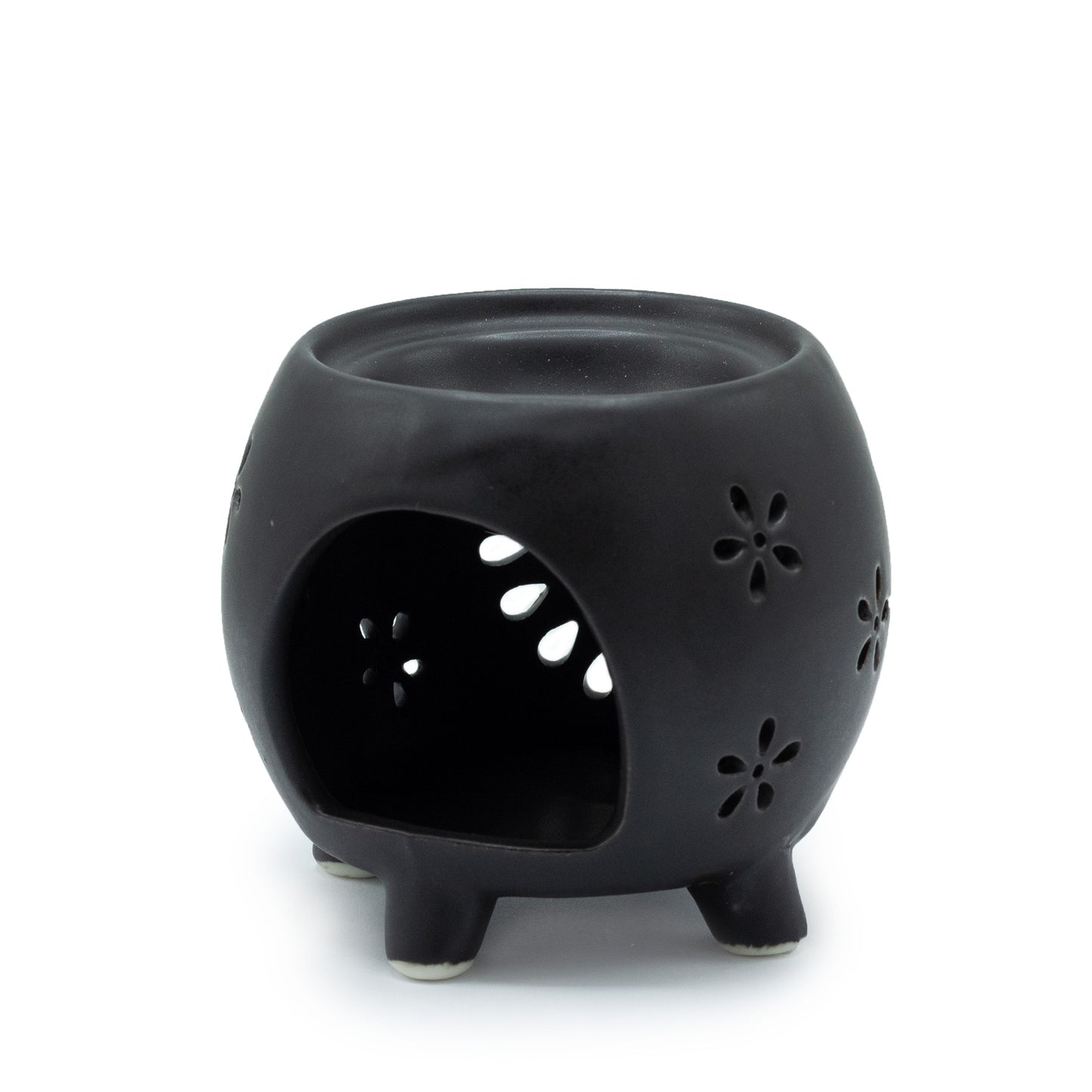 Carefully sourced by The Original Candle Company and featuring a squat pot style with flower purst pattern in matt black, this oil burner and wax warmer will make an attractive decoration in any room. This image shows the back with the cut-out for the tealight.