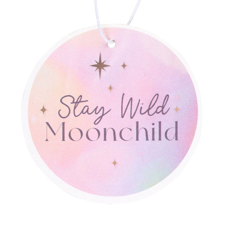 Peach fragranced car air freshener in a round shape with the phrase stay wild moonchild.
