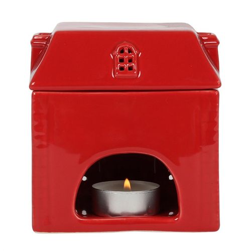 This adorable, red ceramic house oil burner and wax warmer is sure to delight. Perfect for all year round use and a stand-out piece for the festive season. Simply place a lit tealight inside, remove the lid, add fragrance oil or wax melts to the bowl and wait for the calming scent to fill the air. Always remove the lid whilst in use. Image highlights the tealight cut-out.
