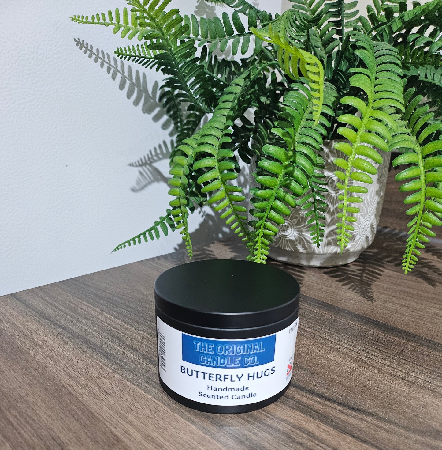 Butterfly Hugs candle infused with bright apple, summer fruits, and vanilla, creating a refreshing and uplifting aroma. Beautifully crafted for a premium scent experience.