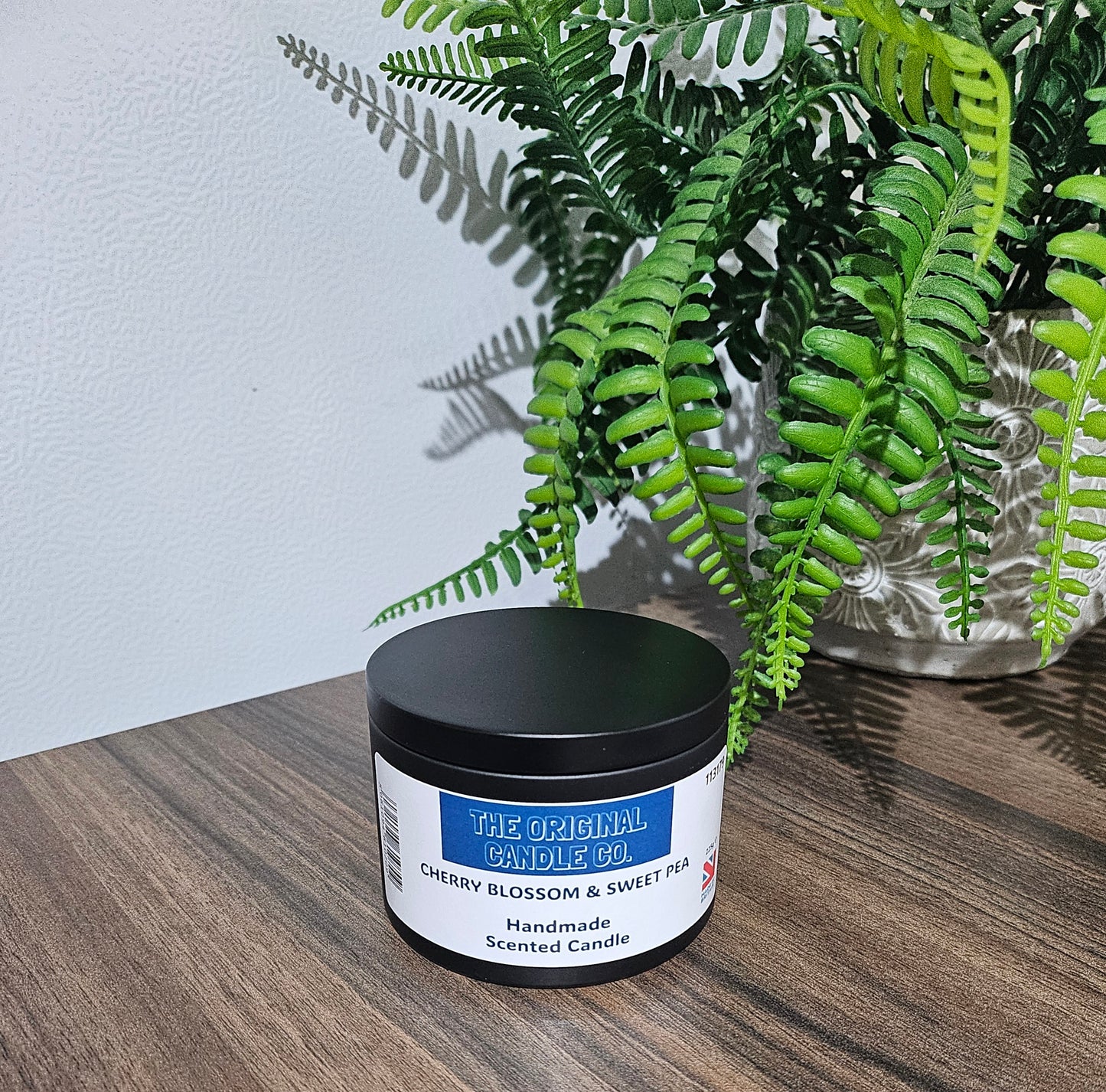 Cherry Blossom & Sweet Pea candle infused with tropical fruits, citrus, and floral tones, creating a fresh and uplifting fragrance experience. Beautifully crafted for a lasting aroma.