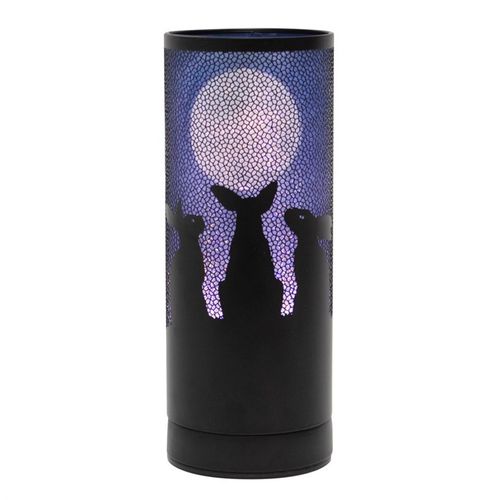 Moon Gazing Hares aroma lamp featuring Lisa Parker’s enchanting artwork of three hares beneath a glowing full moon. Illuminates beautifully while gently diffusing fragrance oils or wax melts