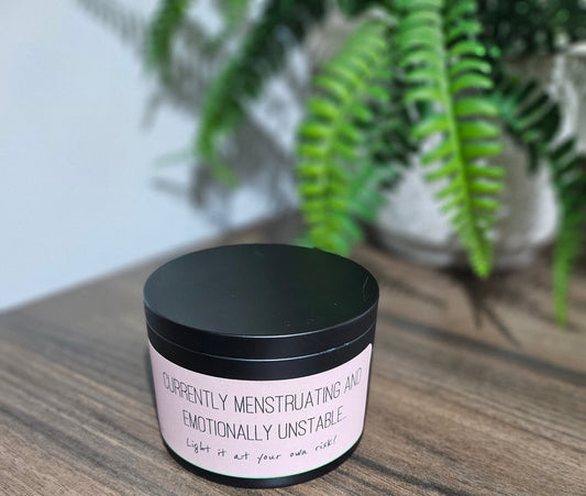 Expertly crafted by The Original Candle Company, this 161g vanilla handmade insult candle black tin with the phrase "Currently Menstruating And Emotionally Unstable" delivers an opulent and captivating aroma, designed to refresh any space with refined and indulgent fragrance notes of vanilla whilst offering a source of insult and humour.