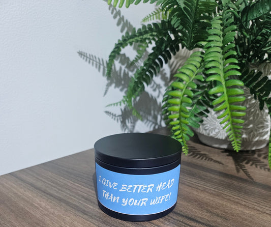 Expertly crafted by The Original Candle Company, this 161g vanilla handmade insult candle black tin with the phrase "I Give Better Head Than Your Wife" delivers an opulent and captivating aroma, designed to refresh any space with refined and indulgent fragrance notes of vanilla whilst offering a source of insult and humour.