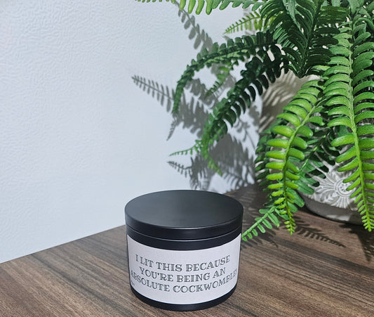 Expertly crafted by The Original Candle Company, this 161g vanilla handmade insult candle black tin with the phrase "I Lit This Because You're Being An Absolute Cockwomble" delivers an opulent and captivating aroma, designed to refresh any space with refined and indulgent fragrance notes of vanilla whilst offering a source of  insult and humour.