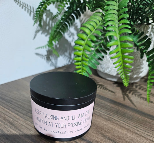 Expertly crafted by The Original Candle Company, this 161g vanilla handmade insult candle black tin with the phrase "Keep Talking And I'll Aim This Tampon At Your Fucking Head" delivers an opulent and captivating aroma, designed to refresh any space with refined and indulgent fragrance notes of vanilla whilst offering a source of insult and humour.
