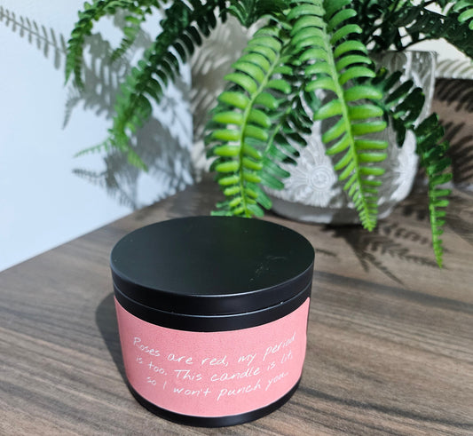 Expertly crafted by The Original Candle Company, this 161g vanilla handmade insult candle black tin with the phrase "Roses Are Ref, My Period Is Too, This Candle Is Lit So I Don't Hit You" delivers an opulent and captivating aroma, designed to refresh any space with refined and indulgent fragrance notes of vanilla whilst offering a source of insult and humour.
