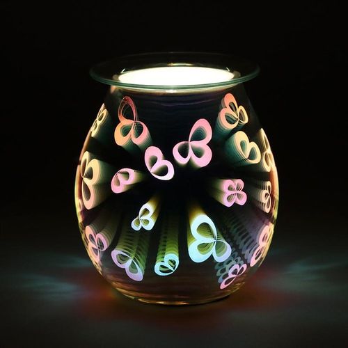 Carefully sourced and selected by The Original Candle Company, this electric oil burner and wax warmer is shown glowing, highlighting its intricate 3D flower petal design and creating a serene ambiance while diffusing fragrance effortlessly.