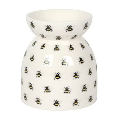 Carefully sourced and selected by The Original Candle Company, this oil burner and wax warmer is displayed from the front, showcasing the spacious dish for effortless wax melting or essential oil diffusion with a charming bee print design.