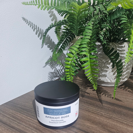 Expertly crafted by The Original Candle Company, this Apricot Rose hand-blended scented tin candle delivers a delicate yet vibrant aroma, designed to create a warm and inviting ambiance with fruity and floral fragrance notes.