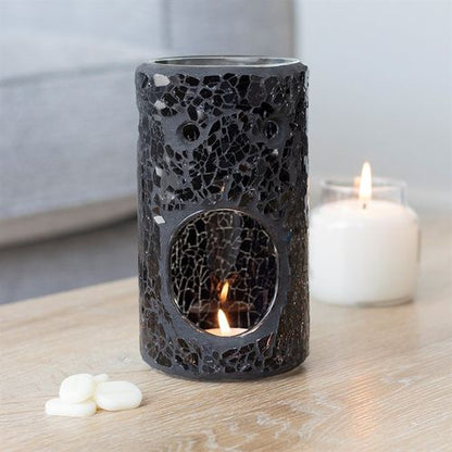 Featuring a stunning black glass detail in a pillar shape, this oil burner and wax warmer carefully selected by The Original Candle Company will add a touch of class to any home.