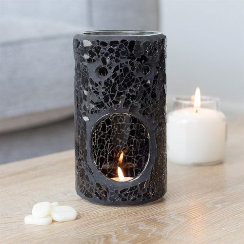 Featuring a stunning black glass detail in a pillar shape, this oil burner and wax warmer carefully selected by The Original Candle Company will add a touch of class to any home.