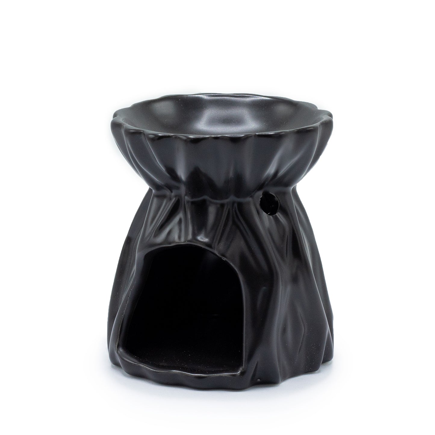 Carefully sourced by The Original Candle Company and featuring a geometric design with a highly decorative glaze in black, this oil burner and wax warmer will make an attractive decoration in any room. Image shows the tealight cut-out at the rear of the product.