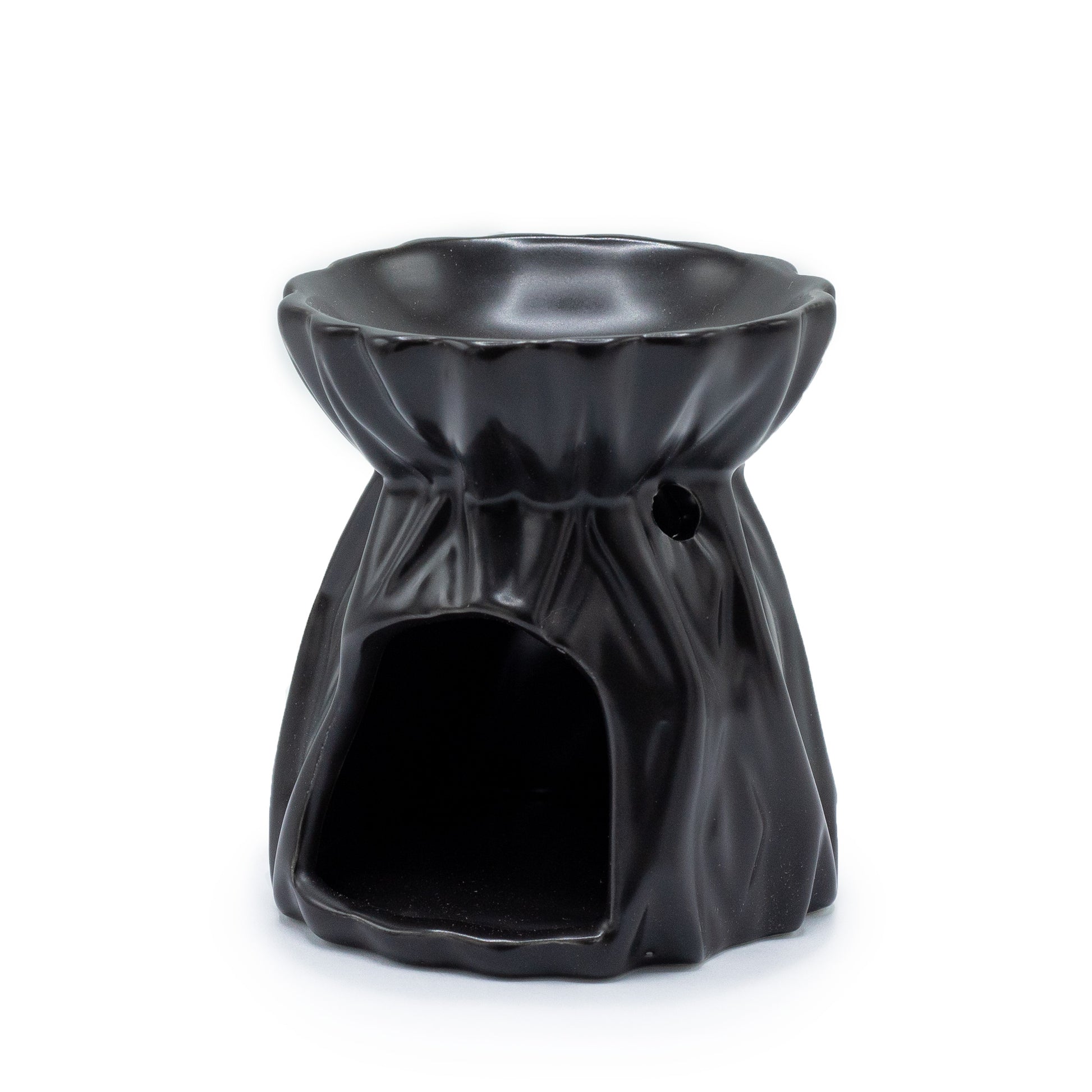 Carefully sourced by The Original Candle Company and featuring a geometric design with a highly decorative glaze in black, this oil burner and wax warmer will make an attractive decoration in any room. Image shows the tealight cut-out at the rear of the product.