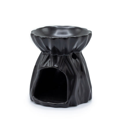 Carefully sourced by The Original Candle Company and featuring a geometric design with a highly decorative glaze in black, this oil burner and wax warmer will make an attractive decoration in any room. Image shows the tealight cut-out at the rear of the product.