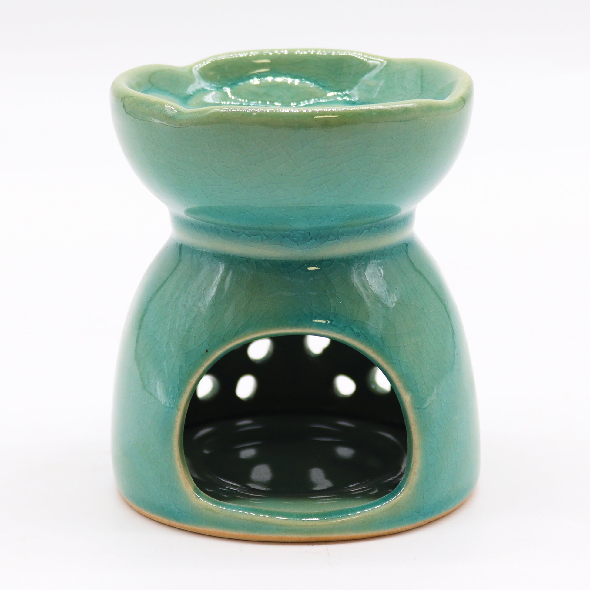 Carefully sourced by The Original Candle Company and featuring a classic tree of life design with a highly decorative glaze in blue, this oil burner and wax warmer will make an attractive decoration in any room. Image shows the tealight cut-out at the rear of the burner.
