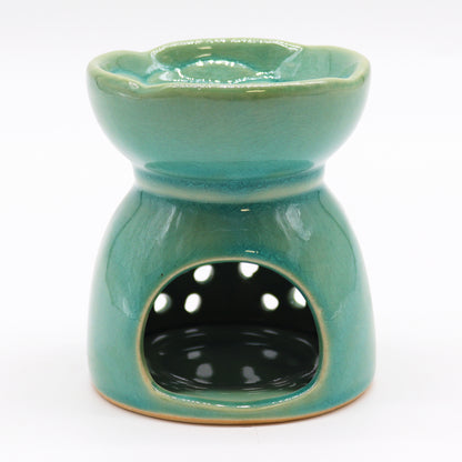 Carefully sourced by The Original Candle Company and featuring a classic tree of life design with a highly decorative glaze in blue, this oil burner and wax warmer will make an attractive decoration in any room. Image shows the tealight cut-out at the rear of the burner.