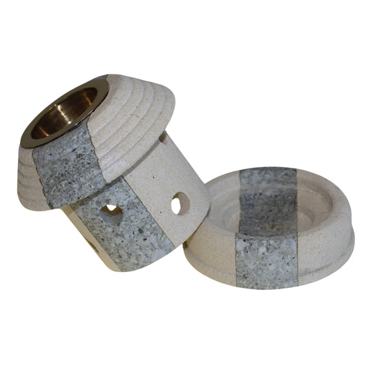 The Combo Lantern Sandstone Oil Burner is shown with its top lifted, revealing the tealight base for effortless wax melting and fragrance diffusion. A practical yet elegant addition to home ambiance