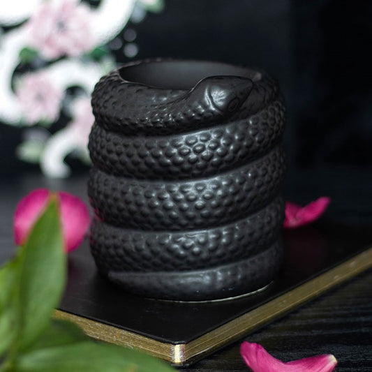 Curl up to your favourite home fragrance with this unique oil burner and wax warmer. Shaped like a coiled, black snake, it's sure to add a touch of mystery to any home. Simply use with diluted essential oils or fragrant wax melts to turn a cold, dark abode into a lush paradise.