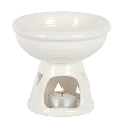 Understated in its off-white glaze, this deep bowl oil burner and wax warmer sourced by The Original Candle Company would make a great additon to any decorating style. With its triangular cut outs to give a shimmering glow from the lit tealight.
