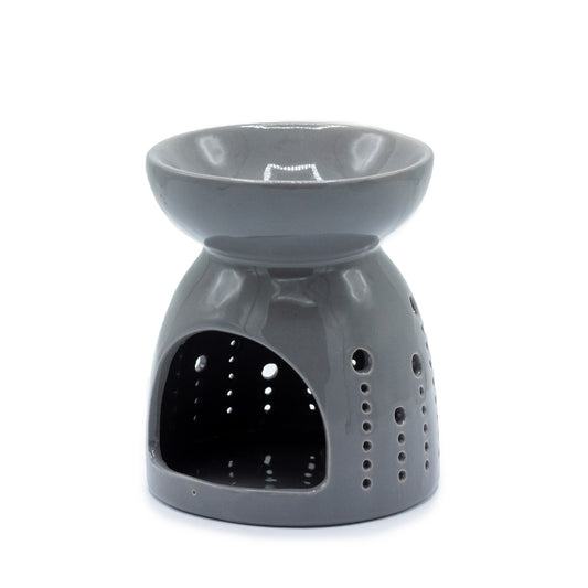 Carefully sourced by The Original Candle Company. A classic style oil burner and wax warmer featuring a bubble cut-out design in a grey glaze, this oil burner and wax warmer will make an attractive decoration in any room.