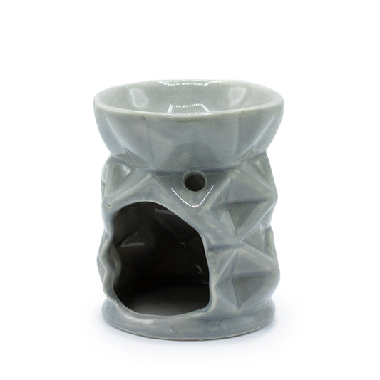 Carefully sourced by The Original Candle Company and featuring a geometric diamond design with a highly decorative glaze in grey, this oil burner and wax warmer will make an attractive decoration in any room. This image shows the rear of the product where the tealight goes.