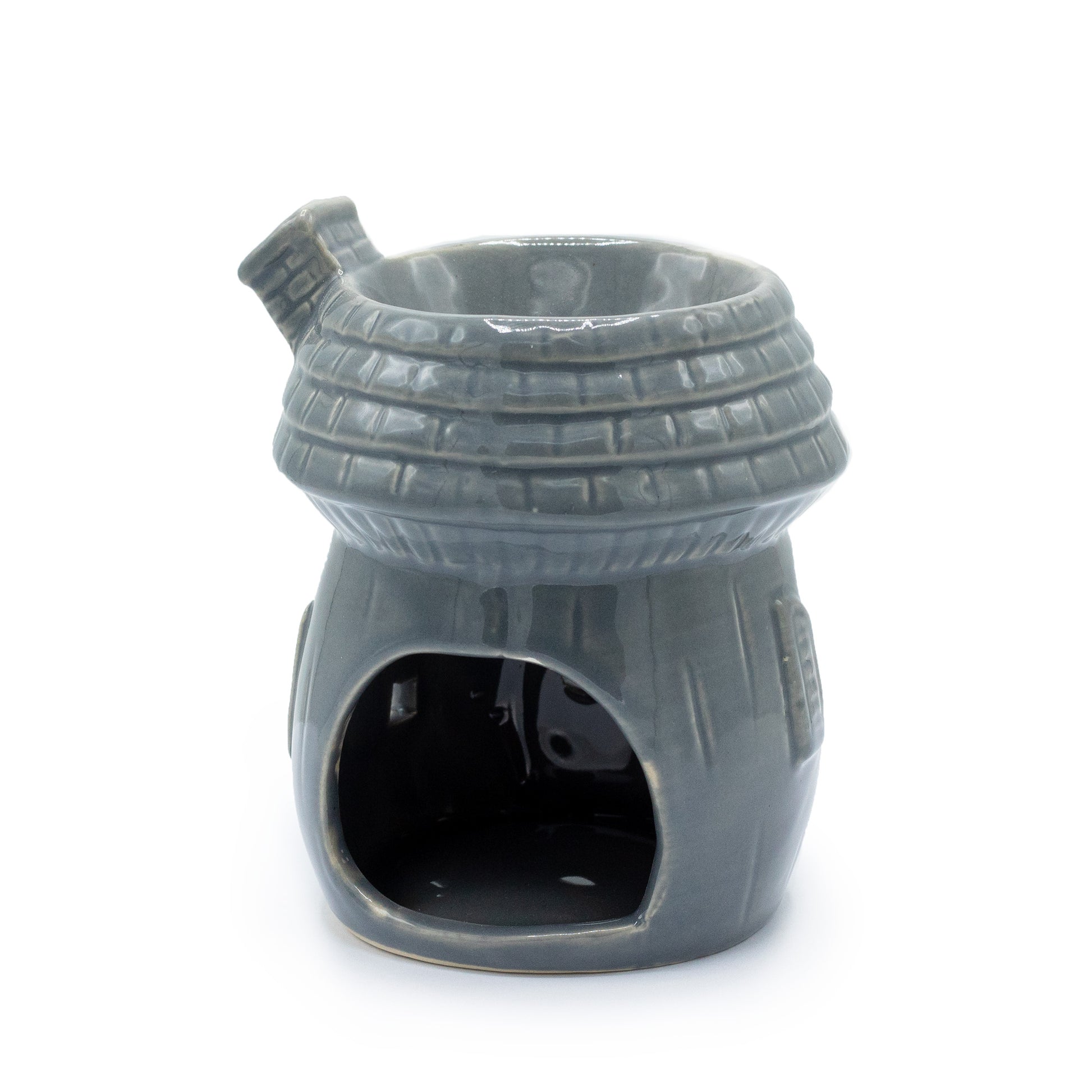 Carefully sourced by The Original Candle Company and featuring a round house style in a grey glaze, this oil burner and wax warmer will make an attractive decoration in any room. This image shows the back of the burner with the tealight cut-out.