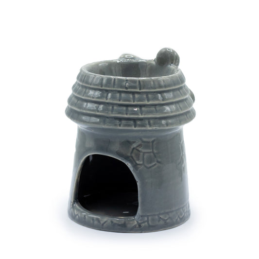 Carefully sourced by The Original Candle Company and featuring a round windmill in a grey glaze, this oil burner and wax warmer will make an attractive decoration in any room. This image shows the rear of the item where the cut-out for the tealight candle will go.