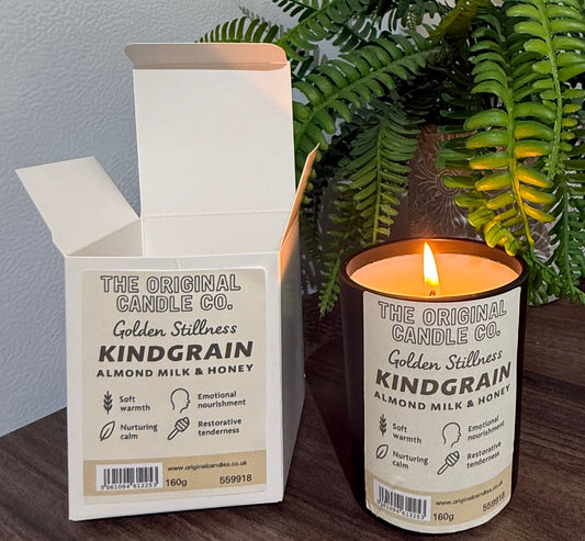ADHD Autism Sensory candle from The Original Candle Co. with packaging on a wooden surface with a plant in the background