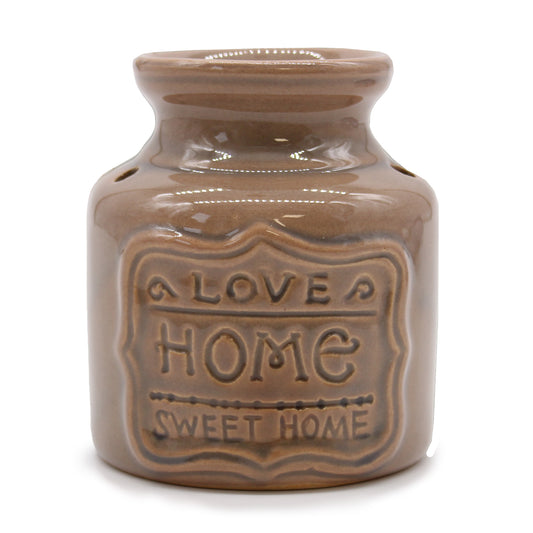 Carefully sourced by The Original Candle Company, this elegant large beige oil burner features a 'Home Sweet Home' embossed design, bringing warmth and charm to any space. Perfect for diffusing essential oils or melting wax, it creates a cosy and inviting atmosphere with a touch of timeless elegance.
