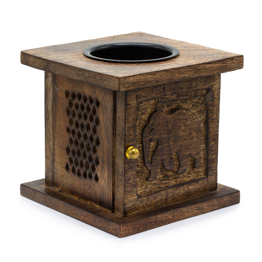 Carefully sourced by The Original Candle Company, this stunning large mango wood oil burner features a beautifully carved Elephant design. Perfect for diffusing essential oils or melting wax, it brings warmth, natural elegance, and spiritual symbolism to any cosy home ambience.
