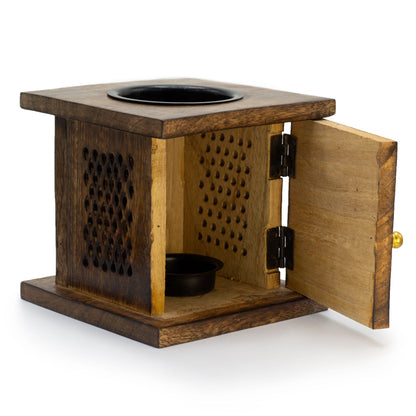 Designed for easy access, the open door view reveals the spacious compartment, perfect for holding a tealight candle. This feature enhances convenience while maintaining the burner’s timeless aesthetic, allowing soft, flickering light to dance through the carved Elephant design.
