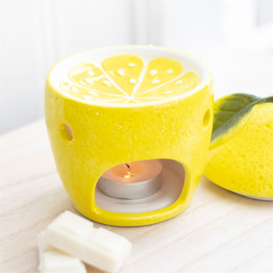 This lemon themed oil burner and wax warmer specially curated by The Original Candle Company. Featuring a vibrant yellow lemon design with a matching lemon wax well.