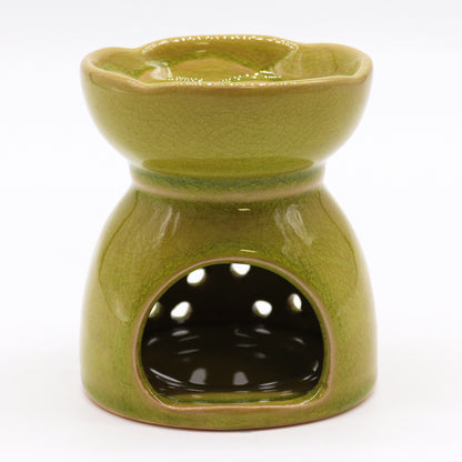 Carefully sourced by The Original Candle Company and featuring a classic tree of life design with a highly decorative glaze in lime, this oil burner and wax warmer will make an attractive decoration in any room. Image shows the back of the burner where the tealight goes.