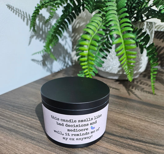 Male Insult Candle - Smells Like Your Ex  from The Original Candle Co. – Available in six bold fragrances that will remind you of him: African Lynx, Sauvaged, inCREEDible, Jouped, Millionaire, and Invictible. Premium scented candle with a cheeky twist, perfect for breakup recovery, self-care, and unapologetic humor.
