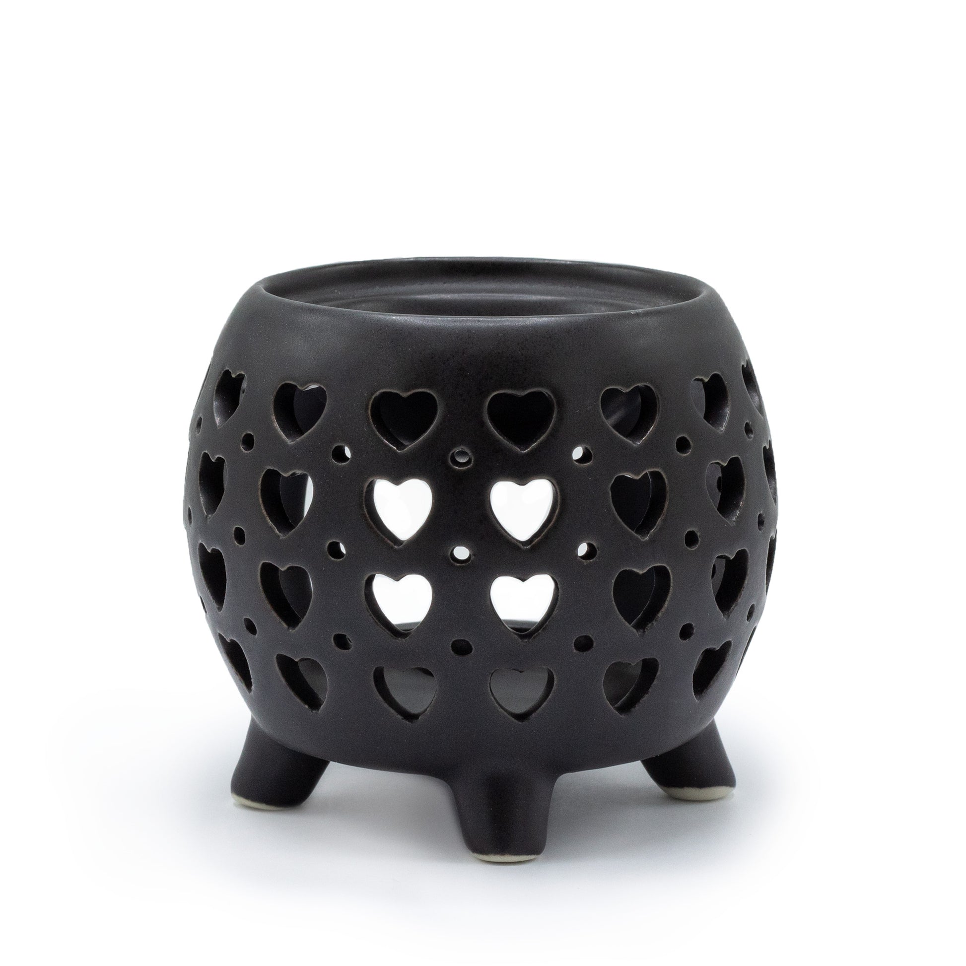 Carefully sourced by The Original Candle Company and featuring a squat pot style with multi heart cut-out pattern in matt black, this oil burner and wax warmer will make an attractive decoration in any room.