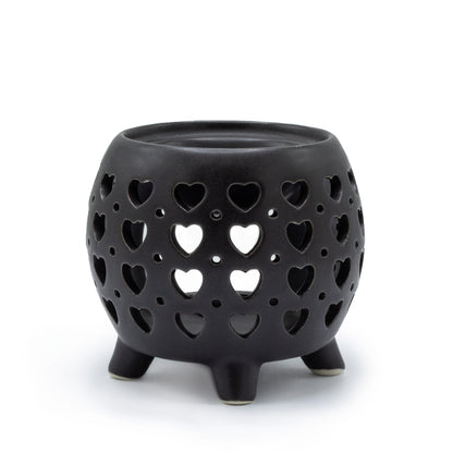Carefully sourced by The Original Candle Company and featuring a squat pot style with multi heart cut-out pattern in matt black, this oil burner and wax warmer will make an attractive decoration in any room.