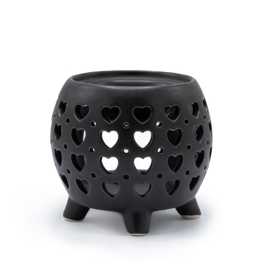 Carefully sourced by The Original Candle Company and featuring a squat pot style with multi heart cut-out pattern in matt black, this oil burner and wax warmer will make an attractive decoration in any room.