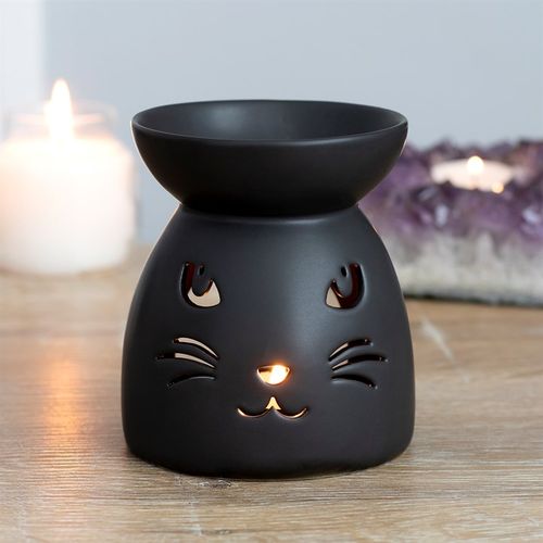 This black ceramic oil burner and wax warmer features a cutout cat face and a cool, matte finish. Compatible with both fragrance oil and wax and is perfect for cat lovers and halloween decor!