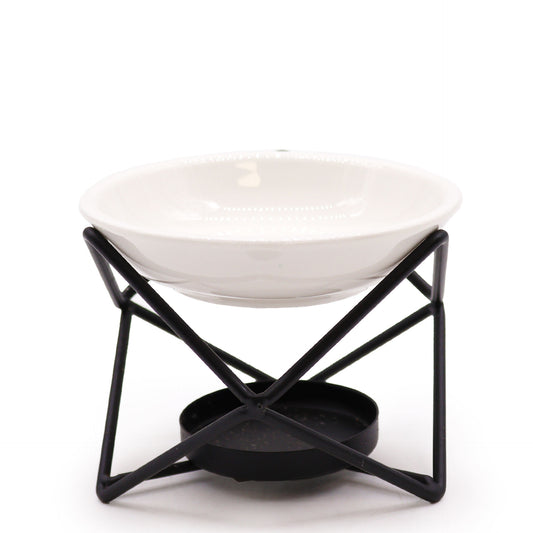 Carefully sourced by The Original Candle Company, this modern oil burner features a striking black hexagonal stand with a white removable ceramic warming dish. Designed for essential oils and wax melts, it blends sleek contemporary aesthetics with effortless functionality.