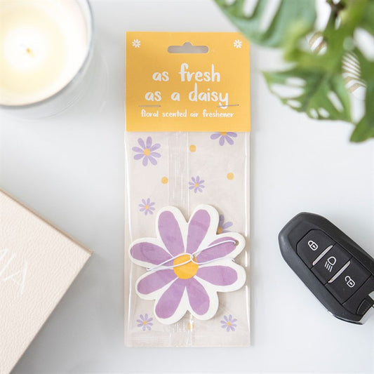 Purple and yellow daisy shaped car air freshener in a colourful design which smells like fresh floral fragrances.