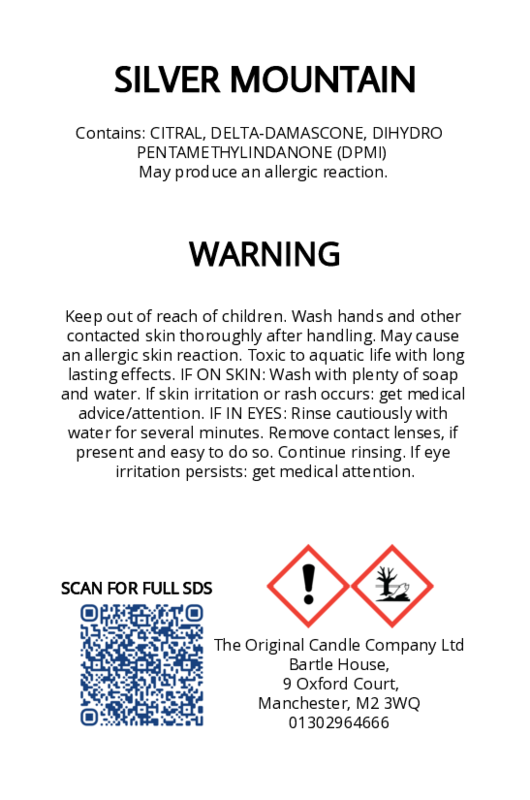 Warning label for a product by Silver Mountain with safety instructions and contact information. From The Original Candle Company
