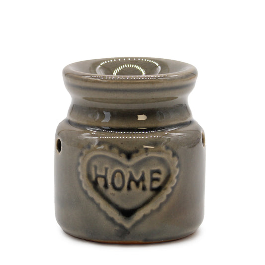 Carefully sourced by The Original Candle Company, this charming small green oil burner features a subtle 'Home' embossed design, adding warmth and comfort to any space. Perfect for diffusing essential oils or melting wax, it creates a soothing and inviting atmosphere.
