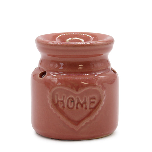 Carefully sourced by The Original Candle Company, this charming small red oil burner features a subtle 'Home' embossed design, adding warmth and comfort to any space. Perfect for diffusing essential oils or melting wax, it creates a soothing and inviting atmosphere.