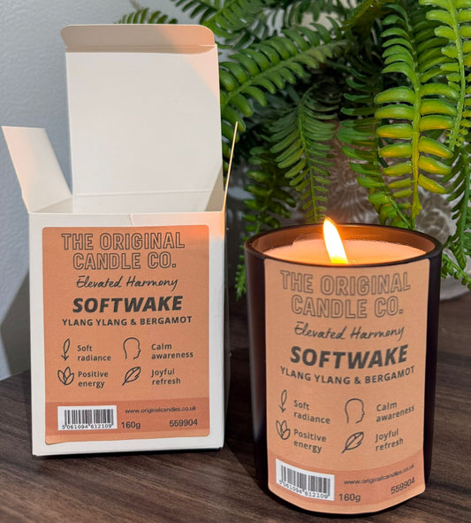 ADHD Autism Sensory candle from The Original Candle Co. with packaging on a wooden surface with a plant in the background