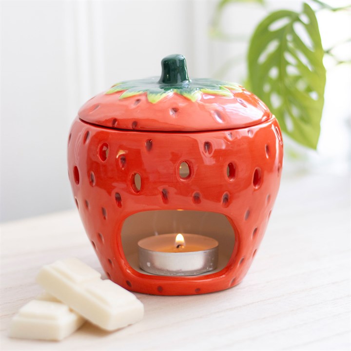 Carefully sourced by The Original Candle Company. This bright red strawberry-themed, novelty oil burner and wax warmer with lid, makes for a fun and vibrant addition to any space and is perfect for infusing with favourite scents. Its playful design adds a touch of whimsy to home decor, making it both functional and decorative. Always remove the lid whilst in use.