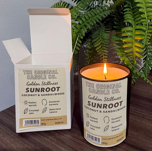 ADHD Autism Sensory candle from The Original Candle Co. with packaging on a wooden surface with a plant in the background
