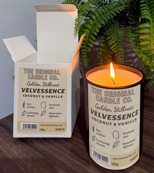 ADHD Autism Sensory candle from The Original Candle Co. with packaging on a wooden surface with a plant in the background